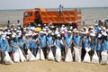 BAKU,AZERBAIJAN- 24 SEPTEMBER 2018 : Group of young students helping one another to clean up the beach, safe ecology