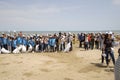 BAKU,AZERBAIJAN- 24 SEPTEMBER 2018 : Group of young students helping one another to clean up the beach, safe ecology