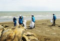 BAKU,AZERBAIJAN- 24 SEPTEMBER 2018 : Group of young students helping one another to clean up the beach, safe ecology