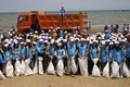 BAKU,AZERBAIJAN- 24 SEPTEMBER 2018 : Group of young students helping one another to clean up the beach, safe ecology