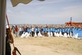 BAKU,AZERBAIJAN- 24 SEPTEMBER 2018 : Group of young students helping one another to clean up the beach, safe ecology