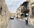 Baku, Azerbaijan, September, 10, 2019. People walking near Mayak art cafe on Kichika Gala street in the old town of Icheri Sheher