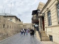 Baku, Azerbaijan, September, 10, 2019. People walking near Mayak art cafe on Kichika Gala street in the old town of Icheri Sheher