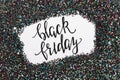 Balack holographic glitter texture with blank space in it and text black friday.