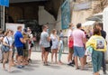 Balaklava, Sevastopol, Crimea - July 8, 2020: Tourists wearing protective masks waiting to enter the historical museum.