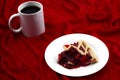 Balance the bitter and sweet, delicious flavor and contrast concept taste with white cup of coffee and cherry pie on red velvet