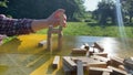 Woman builds a tower with wooden blocks as an analogy of balance life