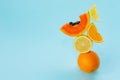 Balance food levitation conceptual creative still life. Balance of fresh fruit on a blue background. Modern concept of