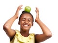 Balance, health and laugh with girl and apple in studio for nutrition, wellness and diet. Food, self care and vitamin c