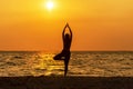 Balance meditation yoga spirit lifestyle mind woman peace vitality, silhouette outdoors on the Sea sunrise, Royalty Free Stock Photo