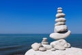 Balance and poise stones against the sea. White Rock zen on the background of blue sky. Royalty Free Stock Photo