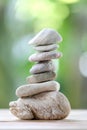 Balance rock or zen stones on wooden floor and have nature green Royalty Free Stock Photo
