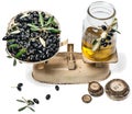 Balance scale fresh olives and olive oil
