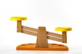 Balance scale or seesaw toy scale isolated white background a symbol of equilibrium is used to compare the weights of different