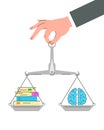 Balance scales with paper books and brain