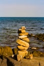Balance stack stone over sea coast skyline Royalty Free Stock Photo