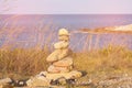 Balance stack stone over seacoast skyline Royalty Free Stock Photo