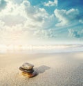Balance stone on the beach in sunrise, vintage tone Royalty Free Stock Photo