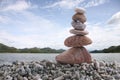 Balance stone on pile rock with river background. Royalty Free Stock Photo