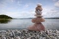 Balance stone on pile rock with river background. Royalty Free Stock Photo