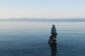 Balance stone pyramid on the sea coast Royalty Free Stock Photo