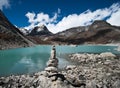 Balance: Stone stack and Sacred Lake near Gokyo