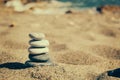 Balance of stones on the beach. Vintage tinting Royalty Free Stock Photo