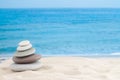 Balance stones pebbles stack pyramid for relaxation meditation with sea or ocean waves and sky on background for horizontal Royalty Free Stock Photo