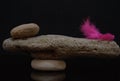 concept life and work equilibrium Balance with stones and red feather