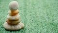 The Balance Stones are stacked as pyramids in a soft natural bokeh background, representing the calm philosophical concept of