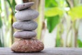 Balance Stones stacked to pyramid in the soft green background. Royalty Free Stock Photo