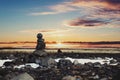 Balance stones, Zen stone stacked, with blurred sunset background Royalty Free Stock Photo