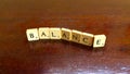 Balance word written on scrabble blocks for content creation