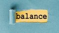 BALANCE word written on yellow under torn paper Royalty Free Stock Photo