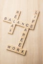 Balance of work, life and relax by wooden crossword