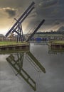 Canal lifting bridge silhouette against sky