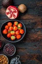 Balanced diet organic healthy food clean eating selection, flat lay on dark wooden background, with space for text