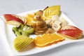 Balanced exotic fruits salad on plate, proper nutrition Royalty Free Stock Photo