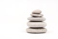 Balanced grey stones over white background Royalty Free Stock Photo