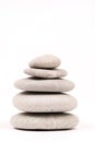 Balanced grey stones over white background Royalty Free Stock Photo