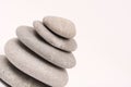 Balanced grey stones over white background Royalty Free Stock Photo