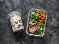 Balanced lunch box - breakfast - greek yogurt with strawberries and banana and lunch - steak, spicy chickpeas and broccoli on a