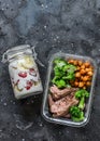 Balanced lunch box - breakfast - greek yogurt with strawberries and banana and lunch - steak, spicy chickpeas and broccoli on a