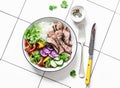 Balanced lunch - grilled beef steak, vegetables and rice on a light background, top view