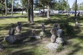 Balanced pyramids from pebbles standing in urban park at the entrance to the Korela Fort or Kexholm Fortress. Priozersk, Russia