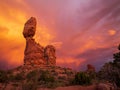 Balanced Rock in sunset with dramatic clouds in Arches National Park, Utah, USA