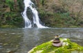 Balanced Rock Zen Stack in front of waterfall. Royalty Free Stock Photo