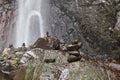 Balanced Rock Zen Stack in front of waterfall. Stones at the foot of the waterfall Royalty Free Stock Photo
