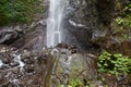 Balanced Rock Zen Stack in front of waterfall. Stones at the foot of the waterfall Royalty Free Stock Photo