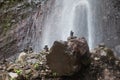 Balanced Rock Zen Stack in front of waterfall. Stones at the foot of the waterfall Royalty Free Stock Photo